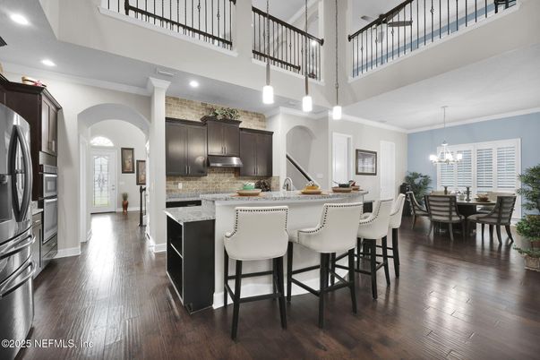 Chandelier, Dining room, Interior, Kitchen, Pendant Lights, Recessed Lighting, Stainless Steel Appliances, Wood Texture Flooring