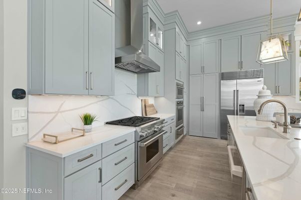 Interior, Kitchen, Marble Walls, Pendant Lights, Recessed Lighting, Stainless Steel Appliances, Wood Texture Flooring
