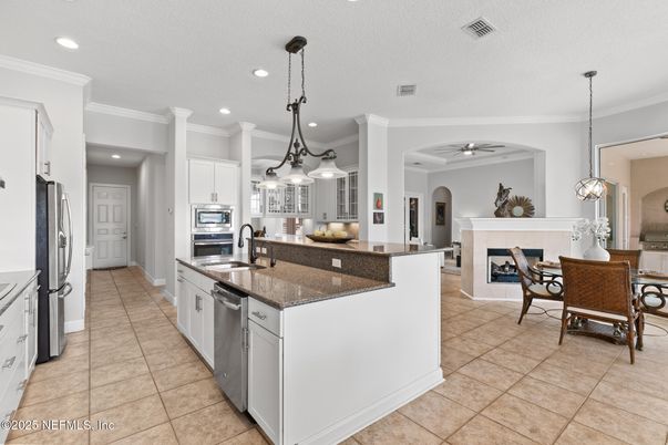 Dining room, Fireplace, Interior, Kitchen, Pendant Lights, Recessed Lighting, Stainless Steel Appliances