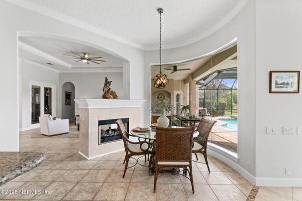 Dining room, Fireplace, Interior, Pendant Lights, Pool, Sun Room