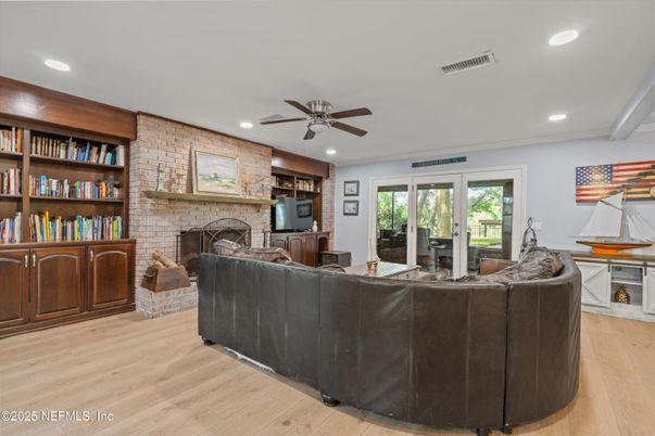 Fireplace, Interior, Living room, Recessed Lighting, Stone Walls, Wood Texture Flooring