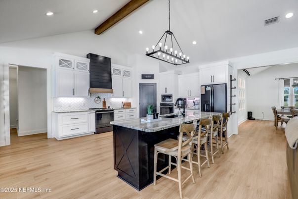 Chandelier, Dining room, Interior, Kitchen, Pendant Lights, Recessed Lighting, Stainless Steel Appliances, Wooden Beams, Wood Texture Flooring