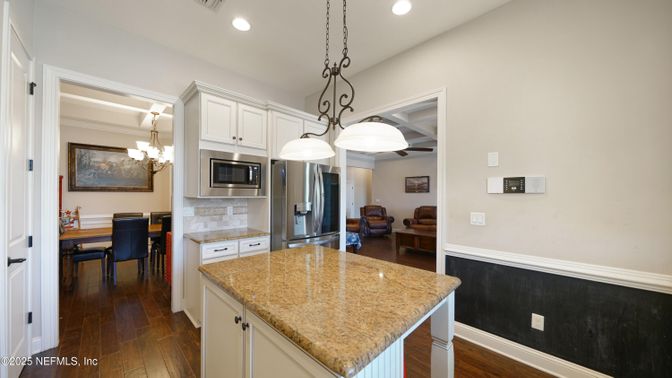 Chandelier, Dining room, Interior, Kitchen, Pendant Lights, Recessed Lighting, Stainless Steel Appliances, Wood Texture Flooring