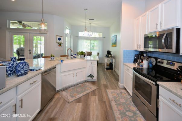 Chandelier, Interior, Kitchen, Pendant Lights, Recessed Lighting, Stainless Steel Appliances, Wood Texture Flooring