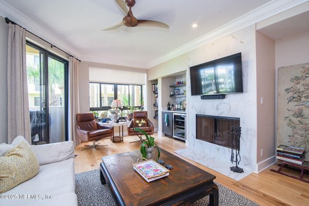 Fireplace, Interior, Living room, Marble Walls, Recessed Lighting, Wood Texture Flooring
