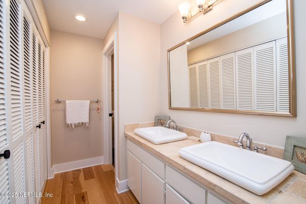 Bathroom, Dual Sink Vanities, Interior, Recessed Lighting, Wood Texture Flooring