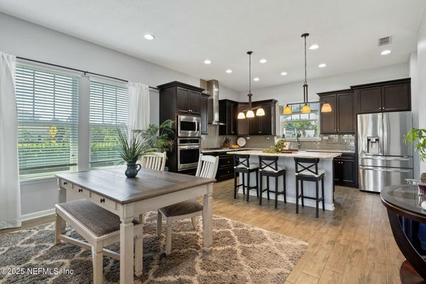 Dining room, Interior, Kitchen, Pendant Lights, Recessed Lighting, Stainless Steel Appliances, Wood Texture Flooring