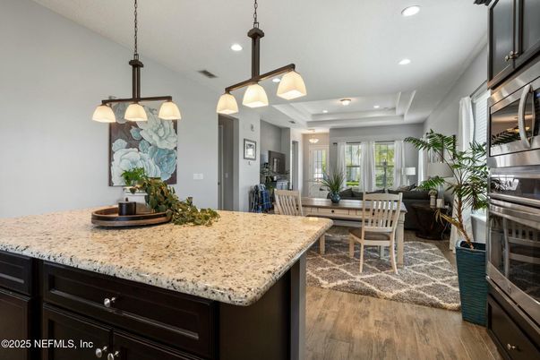 Dining room, Interior, Kitchen, Living room, Pendant Lights, Recessed Lighting, Stainless Steel Appliances, Wood Texture Flooring