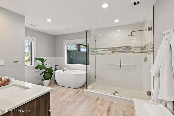 Bathroom, Dual Sink Vanities, Free Standing Baths, Glass Shower, Interior, Recessed Lighting, Wood Texture Flooring