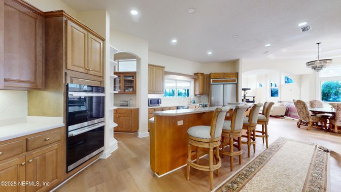 Chandelier, Dining room, Interior, Kitchen, Pendant Lights, Recessed Lighting, Stainless Steel Appliances, Wood Texture Flooring