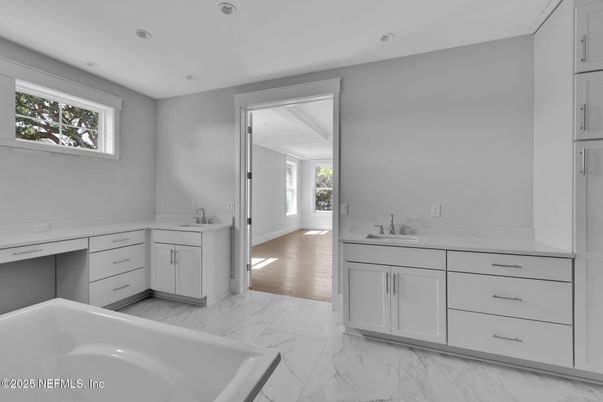 Bathroom, Dual Sink Vanities, Interior, Marble, Recessed Lighting, Wood Texture Flooring