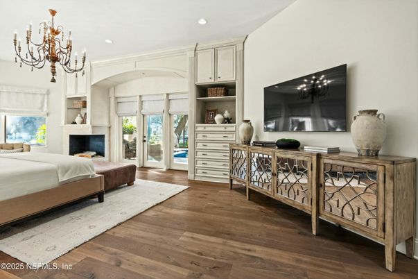 Bedroom, Chandelier, Fireplace, Interior, Recessed Lighting, Wood Texture Flooring