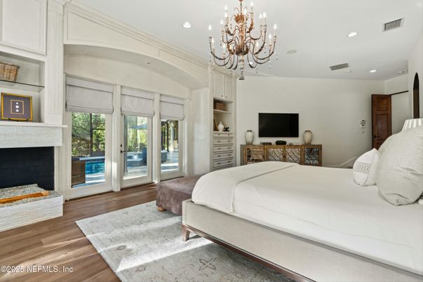Bedroom, Chandelier, Fireplace, Interior, Recessed Lighting, Wood Texture Flooring