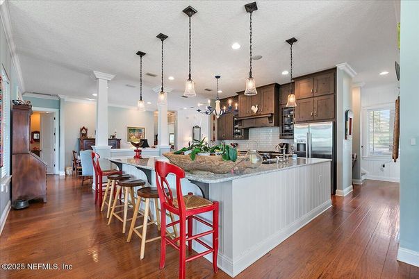 Dining room, Interior, Kitchen, Pendant Lights, Recessed Lighting, Stainless Steel Appliances, Wood Texture Flooring