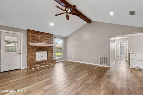 Empty room, Fireplace, Interior, Recessed Lighting, Stone Walls, Wooden Beams, Wood Texture Flooring