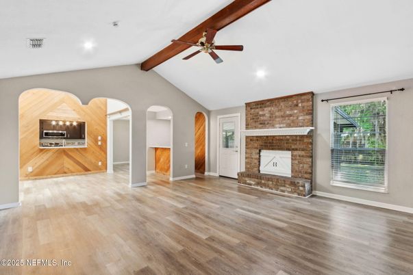 Empty room, Fireplace, Interior, Recessed Lighting, Stone Walls, Wooden Beams, Wood Texture Flooring