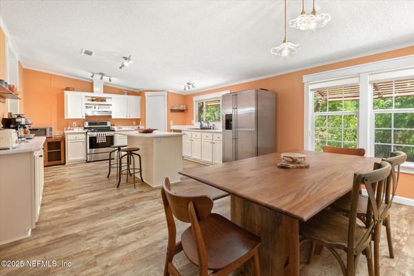 Dining room, Interior, Kitchen, Pendant Lights, Stainless Steel Appliances, Wood Texture Flooring