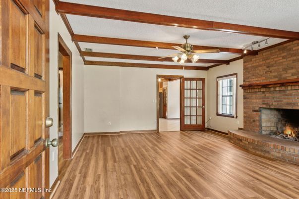 Empty room, Fireplace, Interior, Stone Walls, Wooden Beams, Wood Texture Flooring