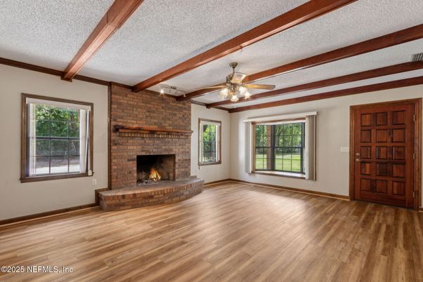 Empty room, Fireplace, Interior, Stone Walls, Wooden Beams, Wood Texture Flooring