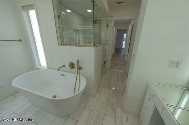Bathroom, Free Standing Baths, Glass Shower, Interior, Recessed Lighting, Wood Texture Flooring