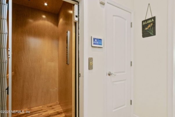 Elevator, Interior, Recessed Lighting, Wood Texture Flooring, Wooden Walls