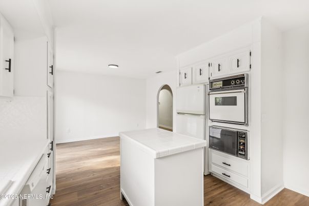 Interior, Kitchen, Recessed Lighting, Tile Countertops, Wood Texture Flooring