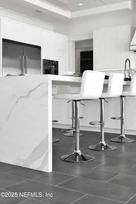 Interior, Kitchen, Marble Walls, Recessed Lighting, Stainless Steel Appliances