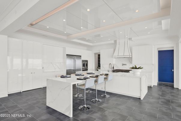Interior, Kitchen, Marble Walls, Recessed Lighting, Stainless Steel Appliances
