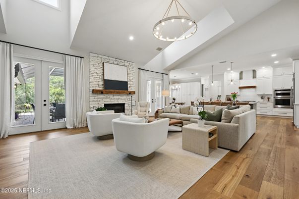 Fireplace, Interior, Kitchen, Living room, Pendant Lights, Recessed Lighting, Stainless Steel Appliances, Stone Walls, Wood Texture Flooring