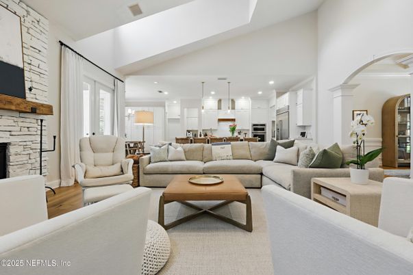 Fireplace, Interior, Kitchen, Living room, Pendant Lights, Recessed Lighting, Stainless Steel Appliances, Stone Walls, Wood Texture Flooring