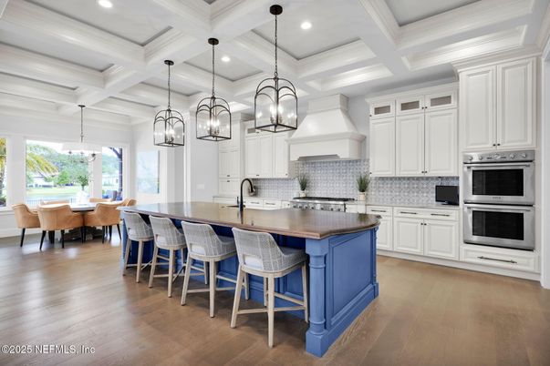 Chandelier, Dining room, Interior, Kitchen, Pendant Lights, Recessed Lighting, Stainless Steel Appliances, Wood Texture Flooring