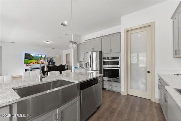 Chandelier, Interior, Kitchen, Living room, Pendant Lights, Recessed Lighting, Stainless Steel Appliances, Wood Texture Flooring