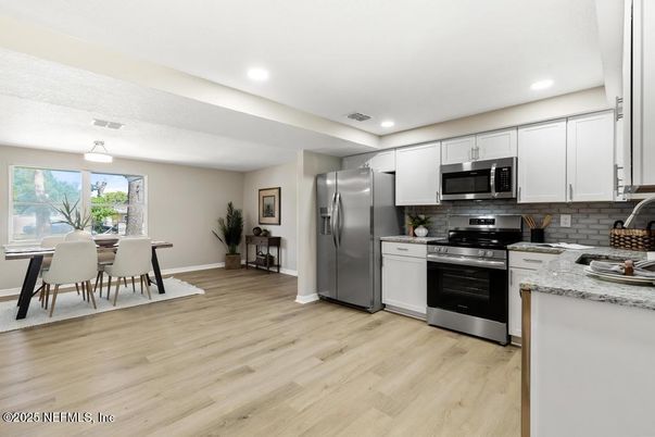 Dining room, Interior, Kitchen, Recessed Lighting, Stainless Steel Appliances, Wood Texture Flooring