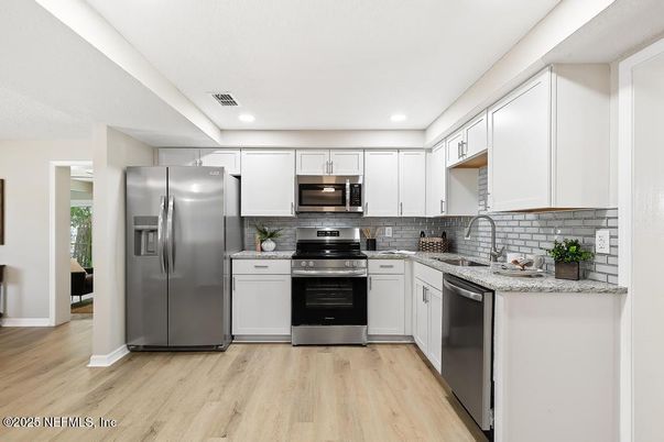 Interior, Kitchen, Recessed Lighting, Stainless Steel Appliances, Wood Texture Flooring