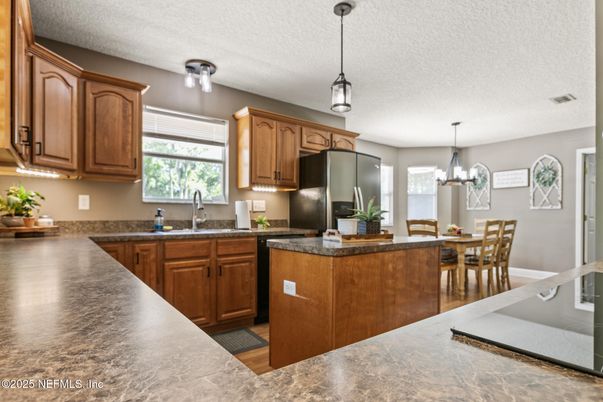 Chandelier, Dining room, Interior, Kitchen, Pendant Lights, Stainless Steel Appliances, Wood Texture Flooring