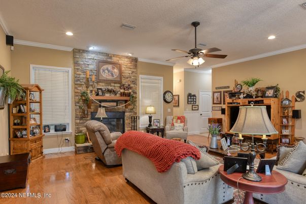 Fireplace, Interior, Living room, Recessed Lighting, Stone Walls, Wood Texture Flooring