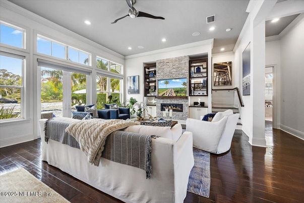 Fireplace, Interior, Living room, Recessed Lighting, Stone Walls, Wood Texture Flooring