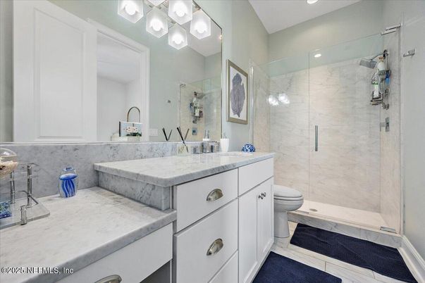 Bathroom, Dual Sink Vanities, Glass Shower, Interior, Marble Walls, Recessed Lighting