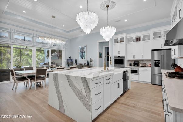 Chandelier, Dining room, Interior, Kitchen, Pendant Lights, Recessed Lighting, Stainless Steel Appliances, Wood Texture Flooring