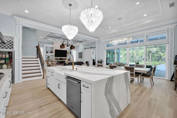 Chandelier, Dining room, Interior, Kitchen, Pendant Lights, Recessed Lighting, Stainless Steel Appliances, Wood Texture Flooring