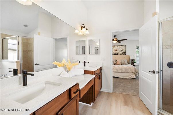 Bathroom, Bedroom, Dual Sink Vanities, Glass Shower, Interior, Wood Texture Flooring