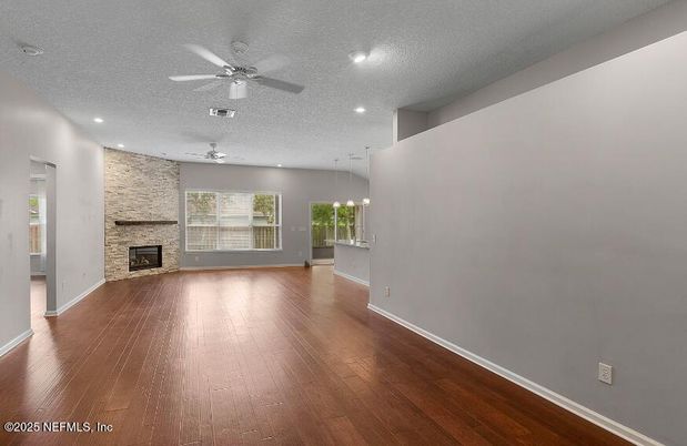 Empty room, Fireplace, Interior, Recessed Lighting, Stone Walls, Wood Texture Flooring
