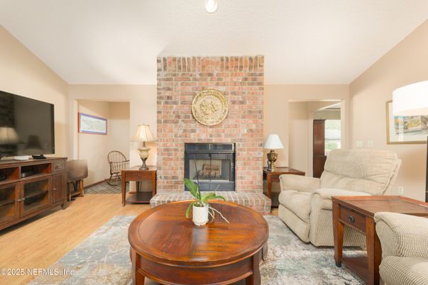 Fireplace, Interior, Living room, Recessed Lighting, Stone Walls, Wood Texture Flooring