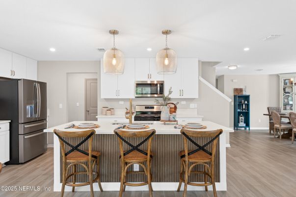 Dining room, Interior, Kitchen, Pendant Lights, Recessed Lighting, Stainless Steel Appliances, Wood Texture Flooring