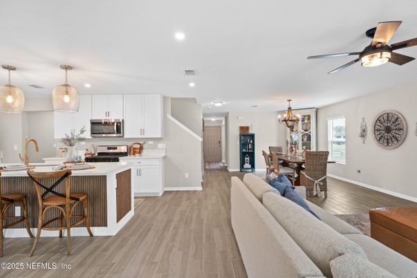 Chandelier, Dining room, Interior, Kitchen, Living room, Pendant Lights, Recessed Lighting, Stainless Steel Appliances, Wood Texture Flooring