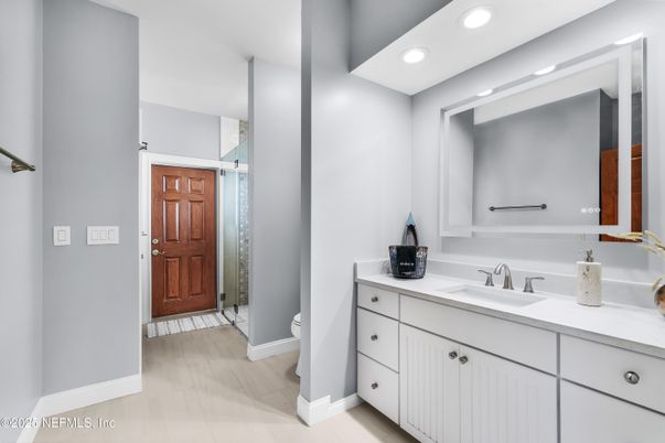Bathroom, Dual Sink Vanities, Interior, Recessed Lighting, Wood Texture Flooring