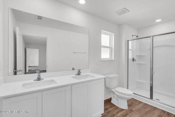 Bathroom, Dual Sink Vanities, Glass Shower, Interior, Recessed Lighting, Wood Texture Flooring