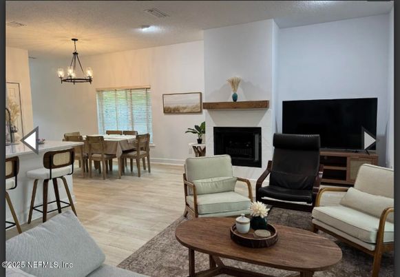 Chandelier, Dining room, Fireplace, Interior, Living room, Pendant Lights, Wood Texture Flooring