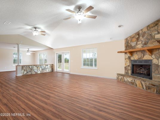 Empty room, Fireplace, Interior, Recessed Lighting, Stone Walls, Wood Texture Flooring