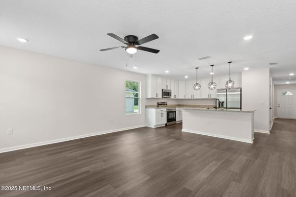 Empty room, Interior, Kitchen, Pendant Lights, Recessed Lighting, Stainless Steel Appliances, Wood Texture Flooring